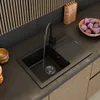 A modern kitchen sink with running water, set against a dark countertop and wooden cabinetry. Náhľad obrázku produktu