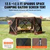 A camping gazebo screen tent set up in a grassy field with a lake and mountains in the background. Podgląd zdjęcia produktu