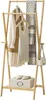 A wooden garment rack displaying clothing and accessories. Náhled obrázku produktu