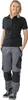 A woman is standing and posing for a product photo. Produktbild-Vorschau