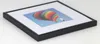 A framed picture of a hot air balloon. Produktbild-Vorschau