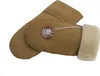 A pair of beige sheepskin mittens with a brown circular logo tag attached. Produktbild-Vorschau