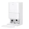 A white robot vacuum cleaner with its base station, which is open to reveal cleaning brushes and a removable tray. Produktbild-Vorschau