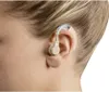 Close-up of a person's ear with a hearing aid. Produktbild-Vorschau