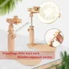 Two wooden embroidery hoop stands on a table, one with an embroidery hoop attached. Produktbild-Vorschau