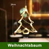 A close-up of a Christmas tree-shaped LED light hanging indoors, with measurements indicated. Podgląd zdjęcia produktu