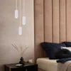 A bedroom scene with a bed and nightstand, featuring pendant lights. Produktbild-Vorschau