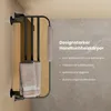 A black towel warmer with towels hanging on it, mounted on a wall with a marble-like texture. Anteprima dell’immagine prodotto