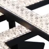 A close-up view of a modern black ceiling lamp with clear, textured light elements. Náhled obrázku produktu