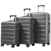 Three gray suitcases of different sizes are displayed side-by-side against a white background. Náhľad obrázku produktu