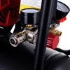 A close-up view of the pressure gauges and fittings on an air compressor. Produktbild-Vorschau