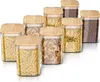 A set of glass storage jars with bamboo lids filled with pasta and coffee beans, arranged on a white background. Produktbild-Vorschau