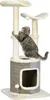 A cat is climbing on a multi-level cat tree with a scratching post and a hideaway. Náhľad obrázku produktu