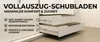 A close-up view of white drawers with metal handles, showcasing their full extension feature. Text overlays highlight product benefits. Produktbild-Vorschau