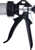 A close-up view of a caulk gun. Anteprima dell’immagine prodotto