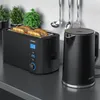 A black toaster and a black electric kettle are displayed on a dark countertop. Produktbild-Vorschau