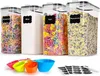 A set of four clear plastic food storage containers filled with different dry goods, along with measuring cups and labels. Anteprima dell’immagine prodotto