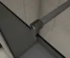 A close-up view of a shower enclosure corner, showing the frame and glass. Produktbild-Vorschau