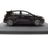 A black Volkswagen Golf VIII R model car is displayed on a black base against a white background. Produktbild-Vorschau
