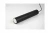 A black cylindrical pendant light fixture with a white end cap, shown on a white background. Produktbild-Vorschau