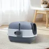 A closed litter box with a scoop is shown on a rug. Anteprima dell’immagine prodotto
