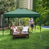 A couple enjoying time in a backyard under a green pop-up gazebo. Podgląd zdjęcia produktu