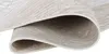 A close-up view of a rolled-up rug, showing the texture and underside. Produktbild-Vorschau