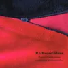 Close-up of a red and black fabric with a zipper, featuring text. Anteprima dell’immagine prodotto