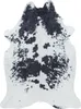 A cowhide rug on a white background.