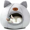 A cat sleeping in a cat bed. Podgląd zdjęcia produktu