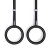 Two black gymnastic rings hanging from straps. Produktbild-Vorschau