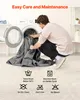 A man is putting a gray blanket into a washing machine, with care instructions displayed below. Produktbild-Vorschau