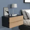 A bedside table with drawers is mounted on a blue wall next to a bed with pillows. Podgląd zdjęcia produktu