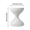A white, hourglass-shaped side table with speckled texture, shown against a white background with dimensions indicated by arrows and text. Anteprima dell’immagine prodotto