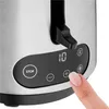 A close-up of a toaster's control panel with a finger pressing a button. Produktbild-Vorschau