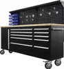 A black metal workbench with a wooden top and a pegboard back panel, equipped with drawers and storage bins, shown on a white background. Produktbild-Vorschau