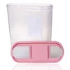 A transparent food storage container with a pink lid, shown against a white background. Anteprima dell’immagine prodotto