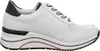 A side view of a white sneaker with navy accents. Produktbild-Vorschau