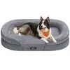 A dog is lying on a gray dog bed. Produktbild-Vorschau