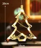 A close-up of a Christmas tree-shaped LED light decoration hanging against a blurred background. Produktbild-Vorschau