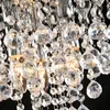 A close-up view of a crystal chandelier with many faceted glass elements. Produktbild-Vorschau