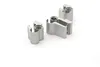 Three silver-colored metal door hinges are arranged on a white background. Produktbild-Vorschau