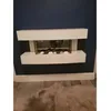 A modern white electric fireplace mounted on a dark blue wall. Náhled obrázku produktu