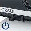 A close-up of a black electrical appliance with the brand name 'GRAEF' visible, and a power switch and power symbol. Podgląd zdjęcia produktu