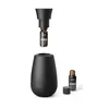 A black aroma diffuser with a bottle of essential oil being inserted into it. Náhľad obrázku produktu
