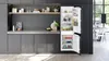 A modern kitchen with a built-in refrigerator and freezer combination. Produktbild-Vorschau