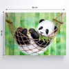 A painting of a panda in a hammock eating bamboo. Náhled obrázku produktu