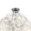 Close-up view of a white leaf-shaped ceiling light fixture. Anteprima dell’immagine prodotto