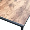 A close-up view of a wooden tabletop with a black metal frame. Produktbild-Vorschau
