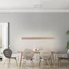 A dining room with a table, chairs, and a pendant light. Produktbild-Vorschau
